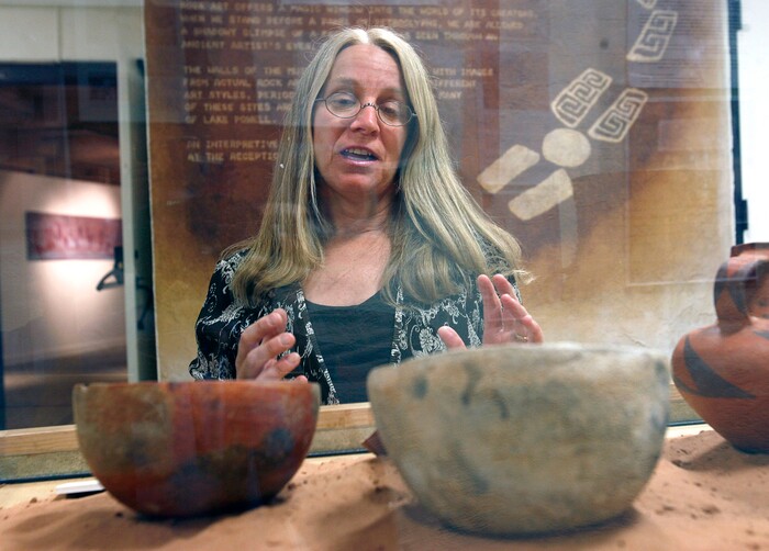 (Al Hartmann | The Salt Lake Tribune) Teri Paul museum director for Edge of the Cedars State Park Museum describes one of the displays of Anasazi pottery at the museum on June 12, 2009.