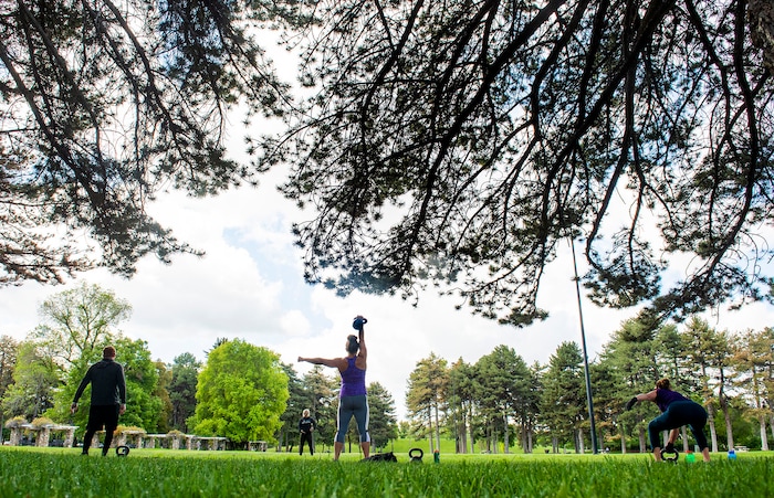 (Rick Egan  |  The Salt Lake Tribune)      Members of a fitness class work out at Liberty Park, Saturday, May 23, 2020.