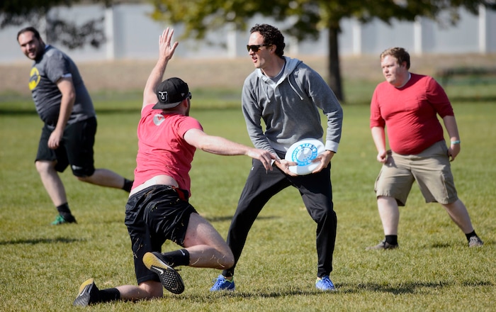 (Steve Griffin  |  The Salt Lake Tribune)  Jared Olsen,of Xima Software, looks to pass as fellow employees play a game of Ultimate Frisbee during lunchtime on River Front Parkway in South Jordan Friday October 13, 2017.