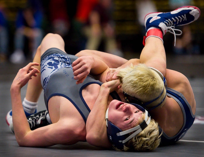 (Trent Nelson | The Salt Lake Tribune)  Pleasant Grove's Oakley Ridge and Layton's Jaron Priest (left), 6A State Championships, high school wrestling quarterfinals in Orem, Wednesday February 7, 2018.