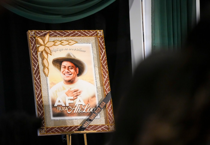 (Bethany Baker  |  The Salt Lake Tribune) A photo is displayed on the stage of Afa Ah Loo, the man shot and killed during the 'No Kings' protest, during the celebration of life at the Salt Palace Convention Center in Salt Lake City on Friday, June 27, 2025.