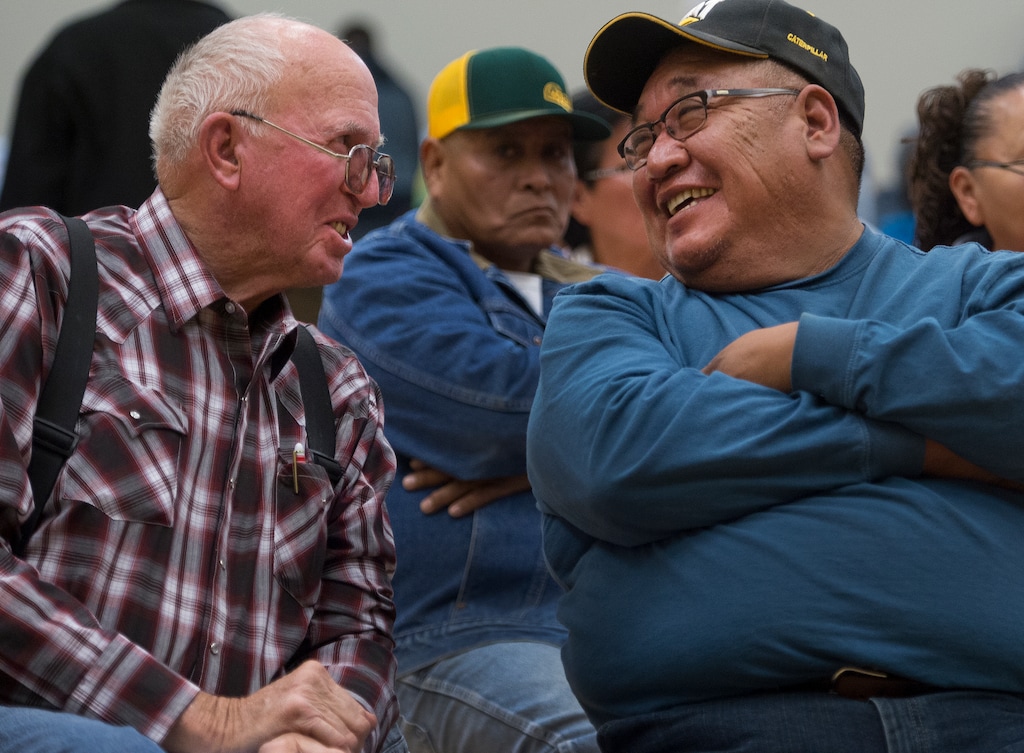 (Leah Hogsten | The Salt Lake Tribune) l-r Gary Guymon and Boyd Lopez, a member of the White Mesa Utes, share a laugh during the meeting last year in Bluff in which San Juan County residents were presented with proposals of the newly redrawn county commission and school board districts.