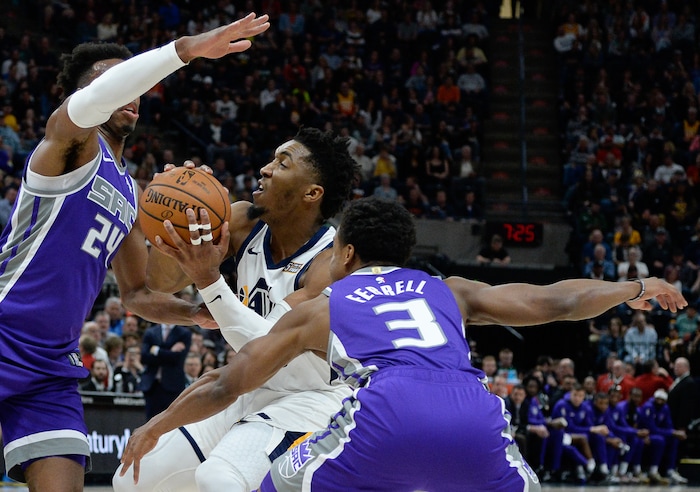 (Francisco Kjolseth  |  The Salt Lake Tribune)  Sacramento Kings guard Buddy Hield (24) and Sacramento Kings guard Yogi Ferrell (3) pressure Utah Jazz guard Donovan Mitchell (45) as the Utah Jazz host the Sacramento Kings in their NBA game at Vivint Smart Home Arena Friday, April 5, 2019, in Salt Lake City.