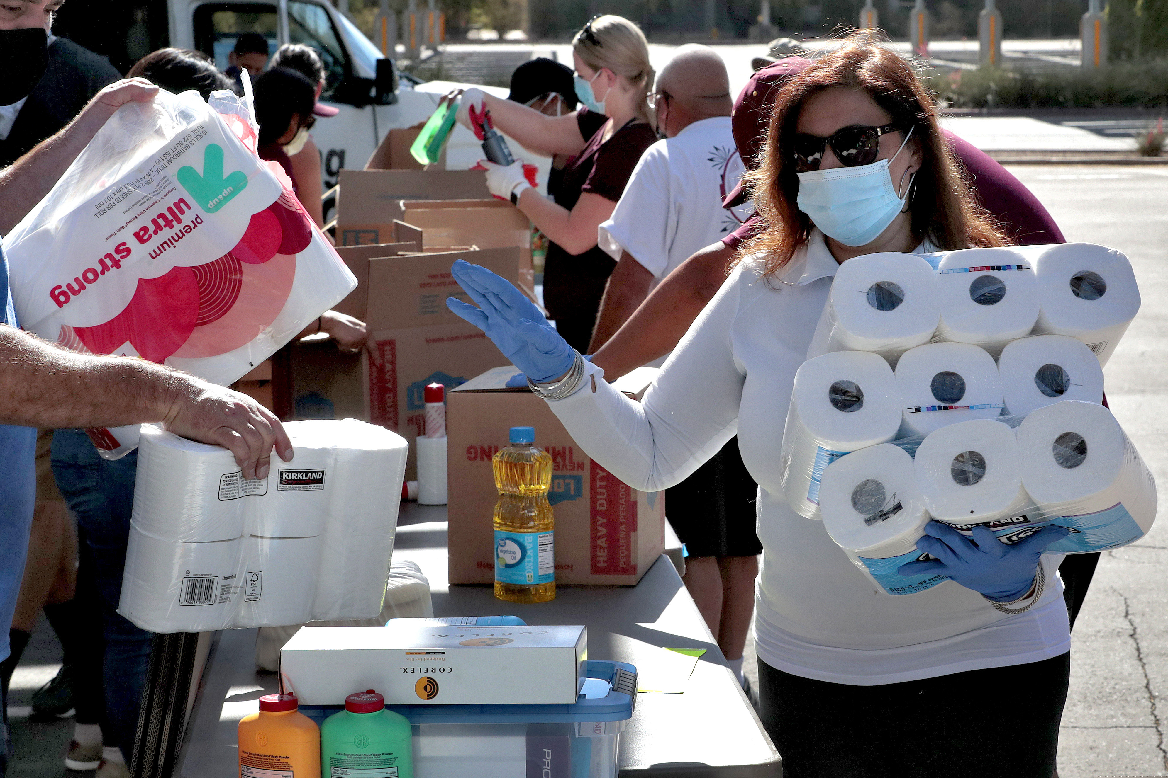 (Matt York | The Associated Press) Volunteers prepare donations for delivery to those affected by COVID-19 on tribal lands Thursday, June 25, 2020, in Tempe, Ariz. The resource drive is for families isolated due to COVID-19 on Navajo, Hualapai, Havasupai and White Mountain Apache tribal lands.