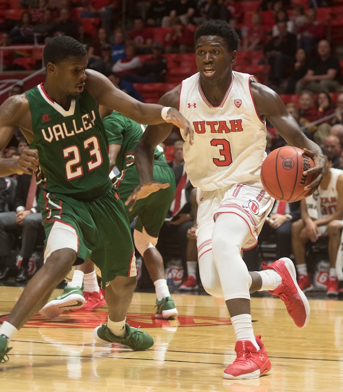 (Rick Egan  |  The Salt Lake Tribune)  Utah Utes forward Donnie Tillman (3), takes the ball inside, as Mississippi Valley State Delta Devils forward LaCurtis Allen (23) defends, in basketball action Utah Utes vs. Mississippi Valley State Delta Devils, at the Jon M. Huntsman Center,  Monday, November 13, 2017.