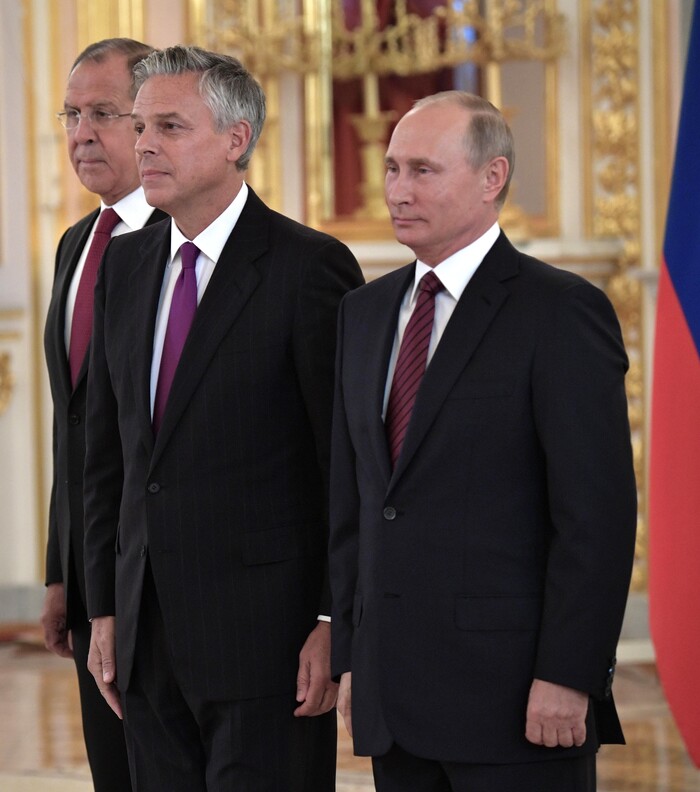 3205043 10/03/2017 October 3, 2017. Russian President Vladimir Putin and Ambassador Extraordinary and Plenipotentiary of the USA to Russia Jon Meade Huntsman, center, at a ceremony to present letters of credence in the Alexander Hall of the Grand Kremlin Palace. Left: Russian Foreign Minister Sergei Lavrov. Aleksey Nikolskyi/Sputnik  via AP