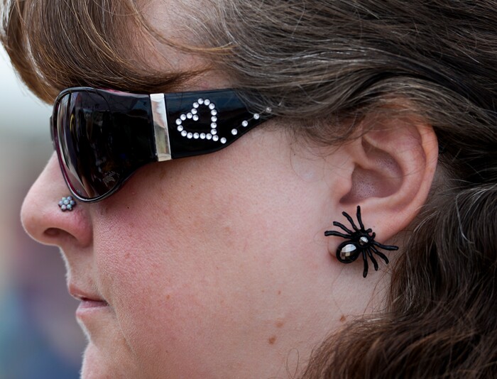 (Leah Hogsten | The Salt Lake Tribune) Shanna Mills wears spider earrings at the Antelope Island Spider Fest 2019 at Antelope Island State Park, August 3, 2019. Spider Fest featured a day full of spider-themed presentations, crafts, guided walks, citizen science, poetry, photography, art and educational presentations about the arachnids on the island.