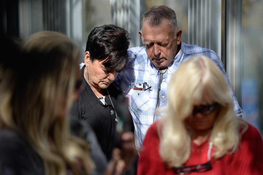(Francisco Kjolseth  |  The Salt Lake Tribune)  Cliven and Carol Bundy bow their heads in prayer as they join other supporters of convicted fraudster Rick Koerber as they gather ahead of his court sentencing in Salt Lake City at the Federal Courthouse on Tuesday, Oct. 15, 2019, ending a nearly two decade white collar crime saga.