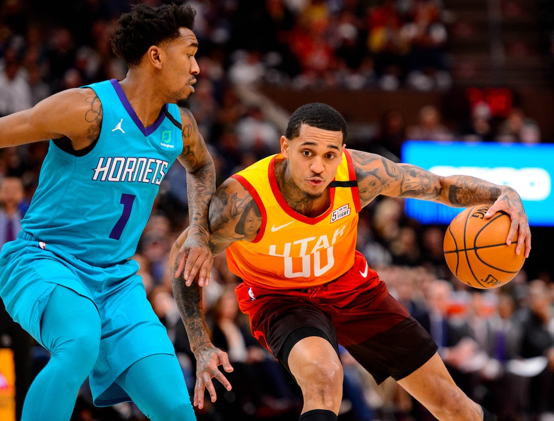 (Trent Nelson  |  The Salt Lake Tribune) Utah Jazz guard Jordan Clarkson (00) drives on Charlotte Hornets guard Malik Monk (1) as the Utah Jazz host the Charlotte Hornets, NBA basketball in Salt Lake City on Friday, Jan. 10, 2020.