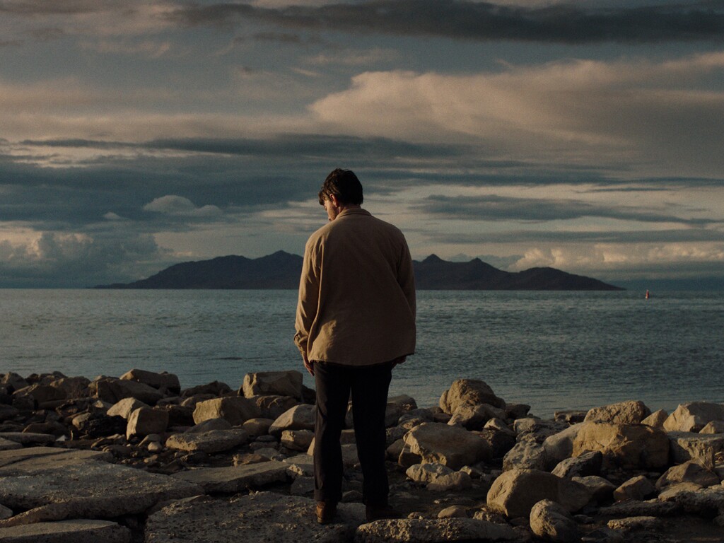 (Courtesy of Jonathan Cuartas) Dwight stands at the water's edge in "My Heart Can't Beat Unless You Tell It To." This scene was shot at the Great Salt Lake.