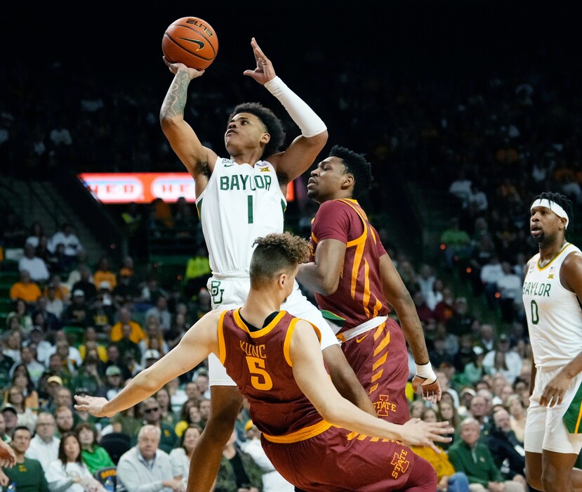 Baylor guard Keyonte George (1) scores against Iowa State forward Aljaz Kunc (5) in the first half of an NCAA college basketball game, Saturday, March 4, 2023, in Waco, Texas. (Chris Jones/Waco Tribune-Herald via AP)