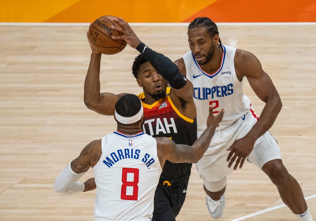 (Rick Egan | The Salt Lake Tribune) Donovan Mitchell (45) splits the LA defenders, forward Kawhi Leonard (2)] and Clippers forward Marcus Morris Sr. (8) to score for the Jazz, in NBA action between the Utah Jazz and the LA Clippers, in game one in the second round of the NBA playoff series at Vivint Arena, on Tuesday, June 8, 2021.