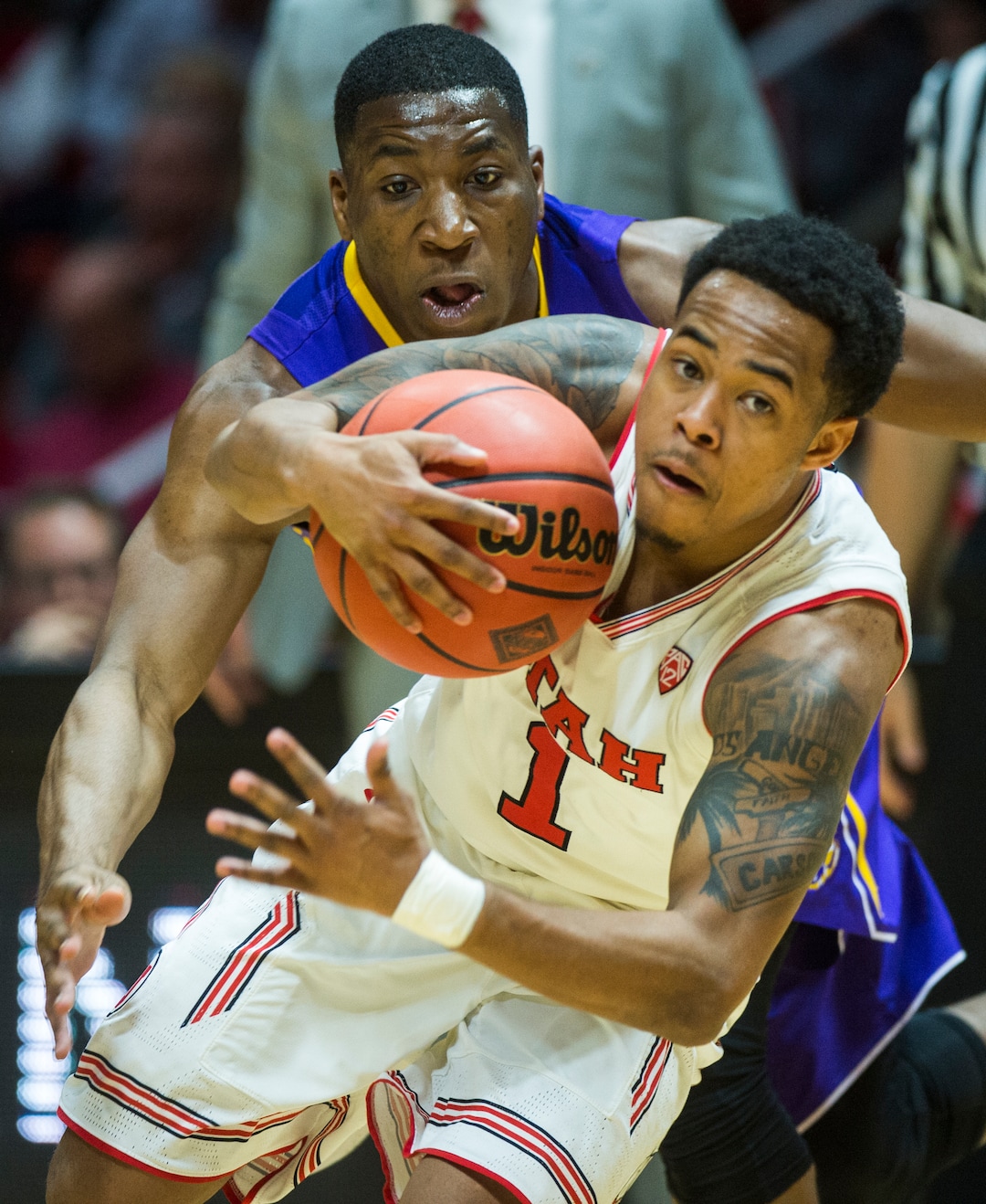 (Rick Egan  |  The Salt Lake Tribune)  LSU Tigers guard Randy Onwuasor (14) tries to get the ball from Utah Utes guard Justin Bibbins (1), in NIT playoff action between Utah Utes and LSU Tigers at the Jon M. Huntsman Center, Monday, March 19, 2018.
