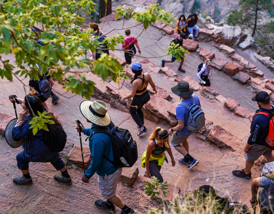 (Leah Hogsten | The Salt Lake Tribune) A steady line of hikers make their way up Walter's Wiggles on the trail to Angel's Landing in Zion National Park, the most sought-after bucket list hike for visitors, Sept. 25, 2021. June 2021 was the busiest month ever for the park, which is on course to have its busiest year ever, surpassing 2019's 4.5 million visitors