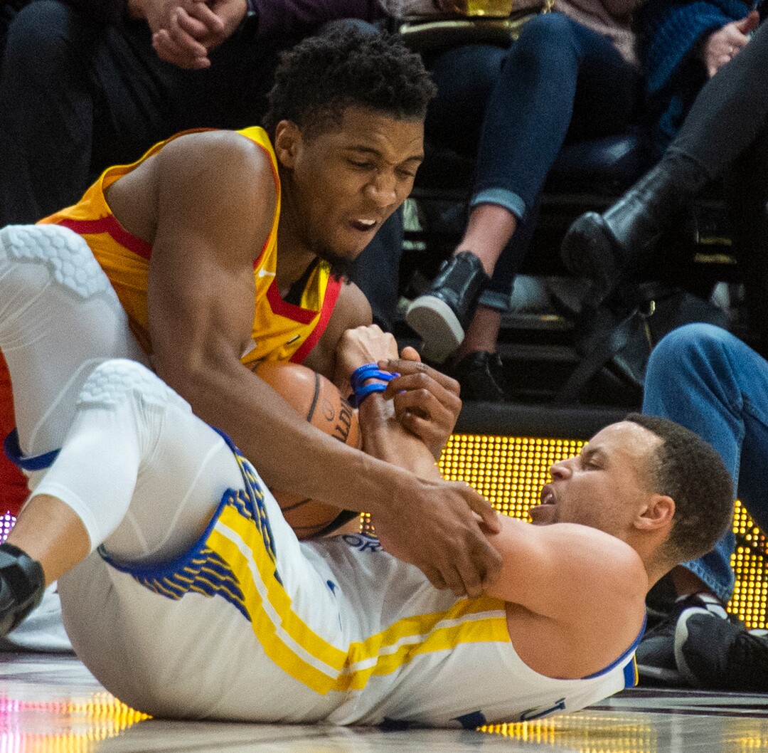 (Rick Egan  |  The Salt Lake Tribune)  Utah Utah Jazz guard Donovan Mitchell (45) goes for a loose ball along with Golden State Warriors guard Stephen Curry (30), in NBA action between Utah Jazz and Golden State Warriors, in Salt Lake City, Wednesday, Dec. 19, 2018.