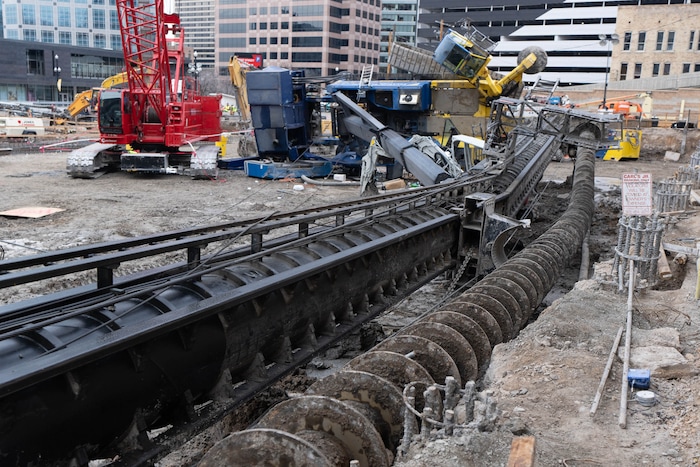 (Francisco Kjolseth | The Salt Lake Tribune) A collapsed drill rig is seen on Wednesday, March 16, 2022, at the intersection of State Street and 200 South. The rig toppled over Tuesday night at the site of the new Astra Tower, crushing two unoccupied parked cars and sending the crane operator to the hospital in serious condition.