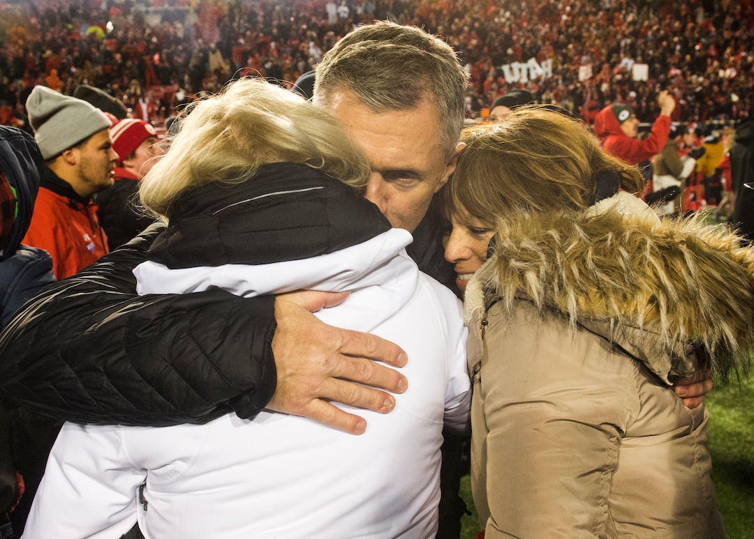 (Rick Egan  |  The Salt Lake Tribune)        Utah Utes head coach Kyle Whittingham hugs family members, after Utah defeated BYU for the 8th straight time, in football action between the Brigham Young Cougars and the Utah Utes, at Rice-Eccles Stadium, Saturday, November 24, 2018.