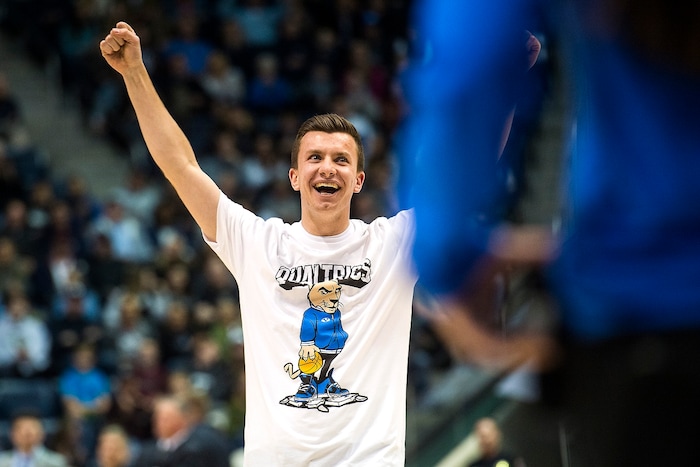 (Chris Detrick  |  The Salt Lake Tribune)  Brigham Young Cougars freshman Christopher McLeod celebrates after making a half-court shot to win $9,000 during the game at the Marriott Center Thursday, December 21, 2017.  