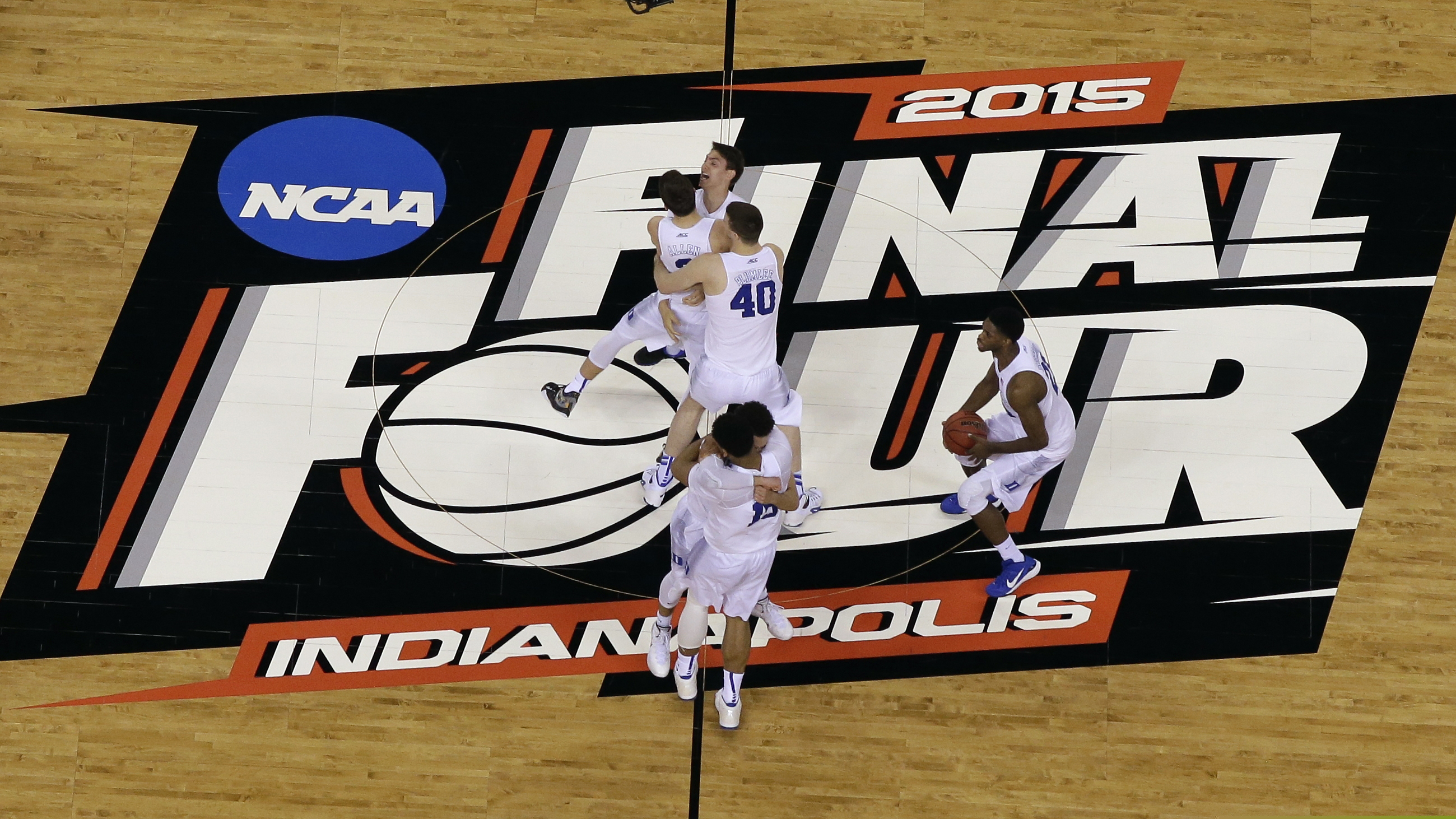(David J. Phillip | AP file photo) Duke players celebrate after the NCAA Final Four college basketball tournament championship game against Wisconsin in Indianapolis, Monday, April 6, 2015. The NCAA announced Monday, Nov. 16, 2020, it plans to hold the entire 2021 men’s college basketball tournament in one geographic location to mitigate the risks of COVID-19 and is in talks with Indianapolis to be the host city.