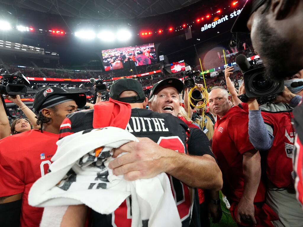 (Leah Hogsten | The Salt Lake Tribune) Utah Utes head coach Kyle Whittingham celebrates with Utah Utes tight end Brant Kuithe (80). The Utes defeated the Oregon Ducks to win the 2021 Pac12 Football Championship title at Allegiant Stadium in Las Vegas, Dec 3, 2021. 