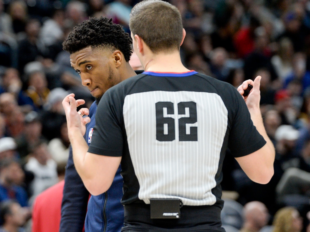 (Leah Hogsten  |  The Salt Lake Tribune) Utah Jazz guard Donovan Mitchell (45) confers with referee JB Derosa as the Utah Jazz host the Golden State Warriors, Dec. 13, 2019 at Vivint Arena.