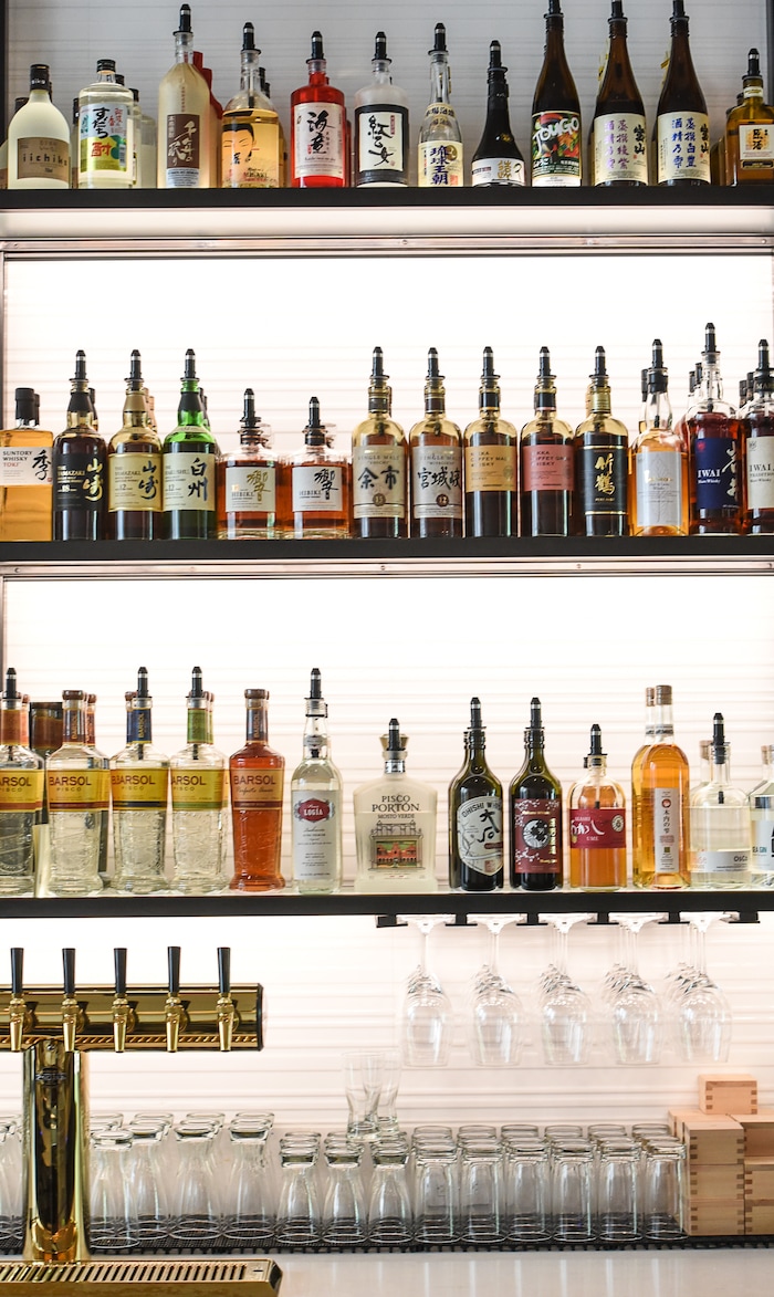 (Francisco Kjolseth  |  The Salt Lake Tribune)  Post Office Place, a new bar by the same owners as Takashi, located next door, welcomes patrons on Tuesday, June 19, 2018. An extensive liquor selection features numerous Japanese spirits named Shochu and Japanese whiskey and pisco. 