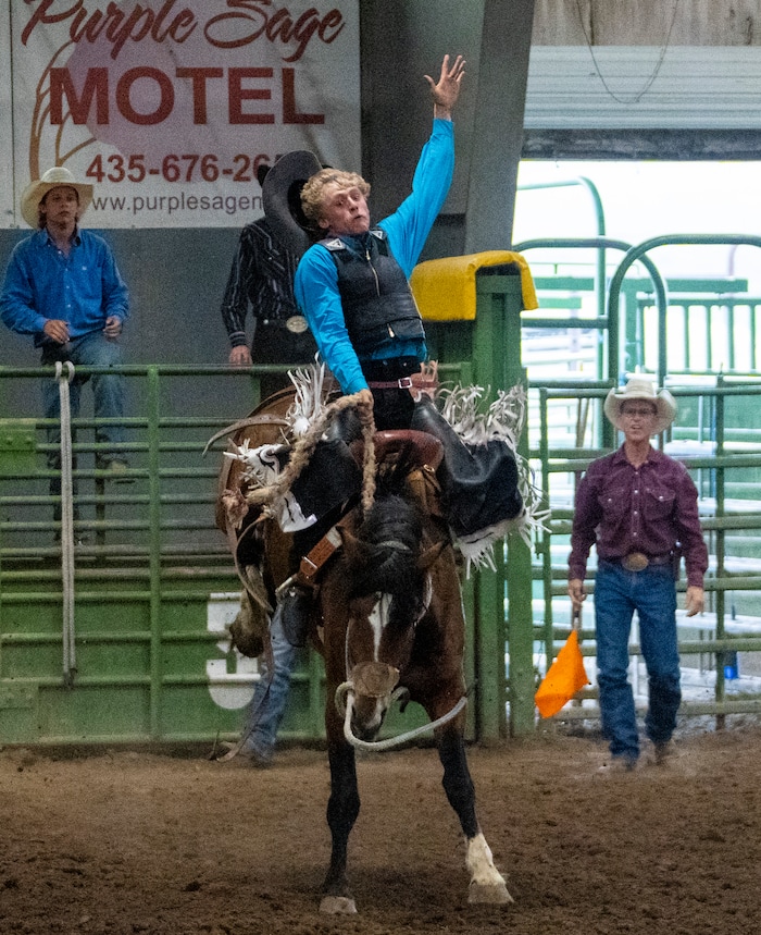 (Rick Egan | The Salt Lake Tribune) 
Jake Marshall competes in the saddle bronc competition in the Panguitch Invitation Rodeo, on Saturday, July 23, 2022.