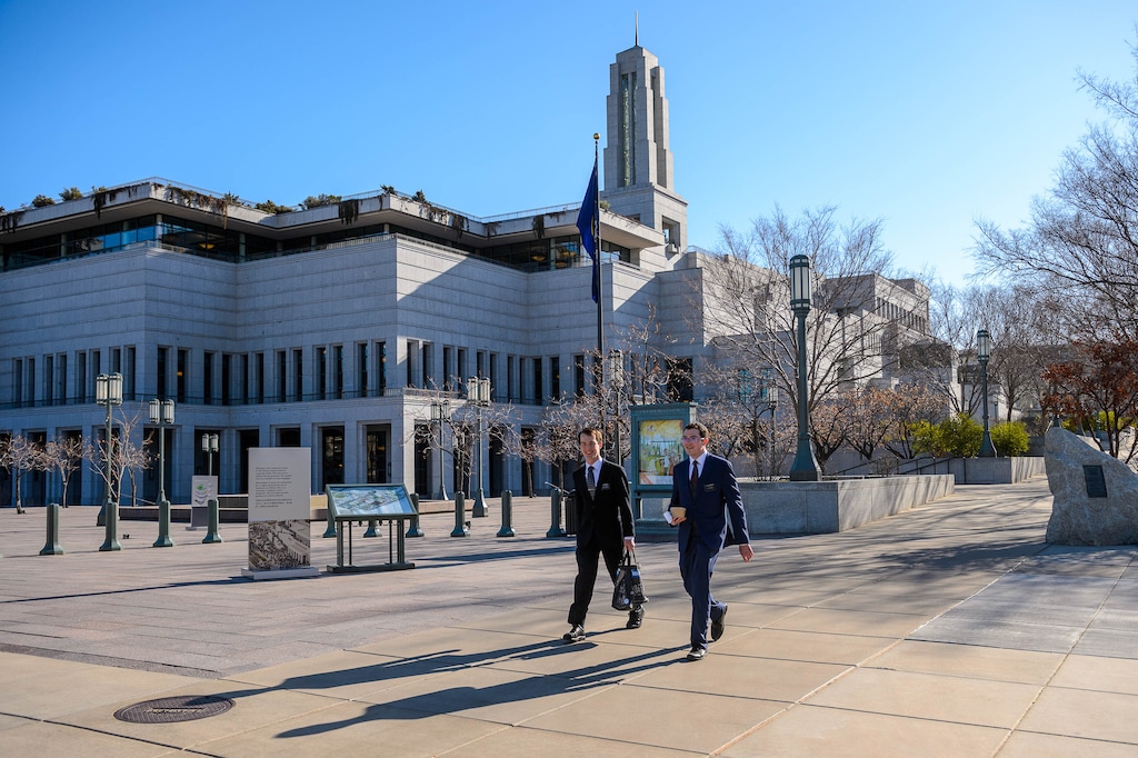 (Trent Nelson | The Salt Lake Tribune) Two missionaries walk past the Conference Center in Salt Lake City just before The Church of Jesus Christ of Latter-day Saints holds General Conference on Saturday, April 4, 2020. The area would usually be packed with tens of thousands of conferencegoers. But because of the coronavirus pandemic, no public attendance is permitted. In fact, the conference is coming from a "small auditorium" in the Church Office Building.