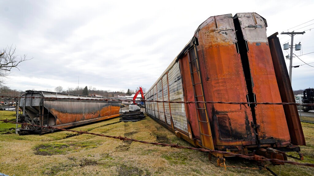 (Gene J. Puskar | AP) Some of the railcars that derailed Friday night when a Norfolk Southern freight train derailed are in the process of being cleaned up on Thursday, Feb. 9, 2023 in East Palestine, Ohio.