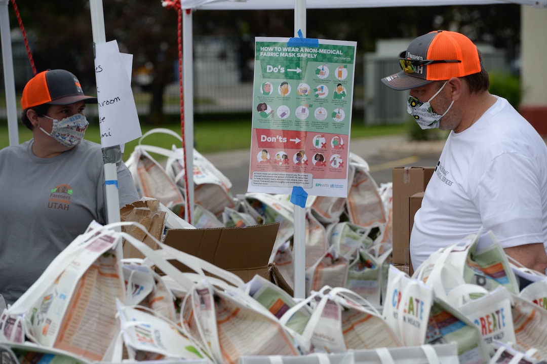 (Francisco Kjolseth  |  The Salt Lake Tribune) The third “Miracle Project” for the nonprofit foundation which raises money to purchase food produced by Utah farmers and then gives to residents in need, takes place at the Utah State Fairpark in Salt Lake City on Monday, July 27, 2020. The food donation from the Utah Farm Bureau’s “Farmers Feeding Utah” program provided food for 600 individuals and families who have recently become unemployed due to the coronavirus.