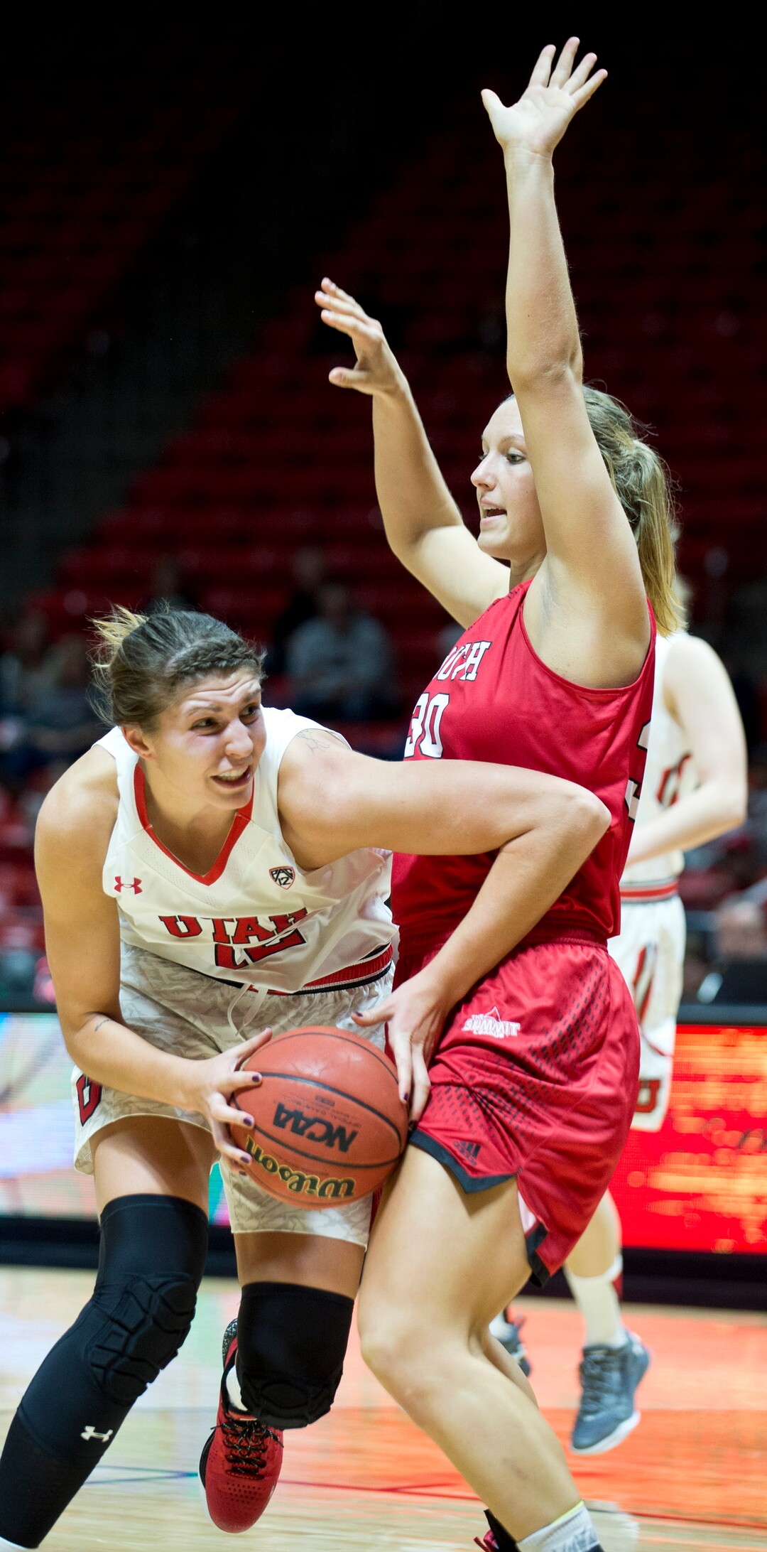 Lennie Mahler  |  The Salt Lake TribuneUtah's Emily Potter drives into South Dakota's Margaret McCloud in a game at the Huntsman Center in Salt Lake City, Friday, Nov. 13, 2015.