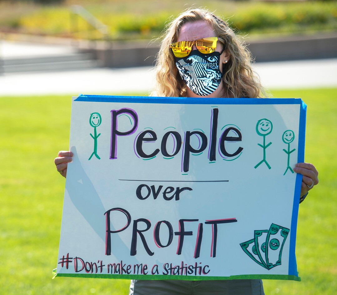 (Rick Egan  |  The Salt Lake Tribune)   Kara Riddle joins protesters during the Mask-In and Car Caravan protest at the State Capitol to demand the Governor and other state and local leaders ensure that Utah school protect students and staff when schools reopen, on Thursday, July 23, 2020.