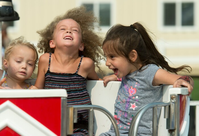 (Rick Egan  |  The Salt Lake Tribune)    Ayla Apple, 3 Kailyn Apple, 5, and Aliyah Bain, 4, spin around on the Tubs o' Fun, at the Davis County Fair in Farmington, Saturday, Aug. 18, 2018.