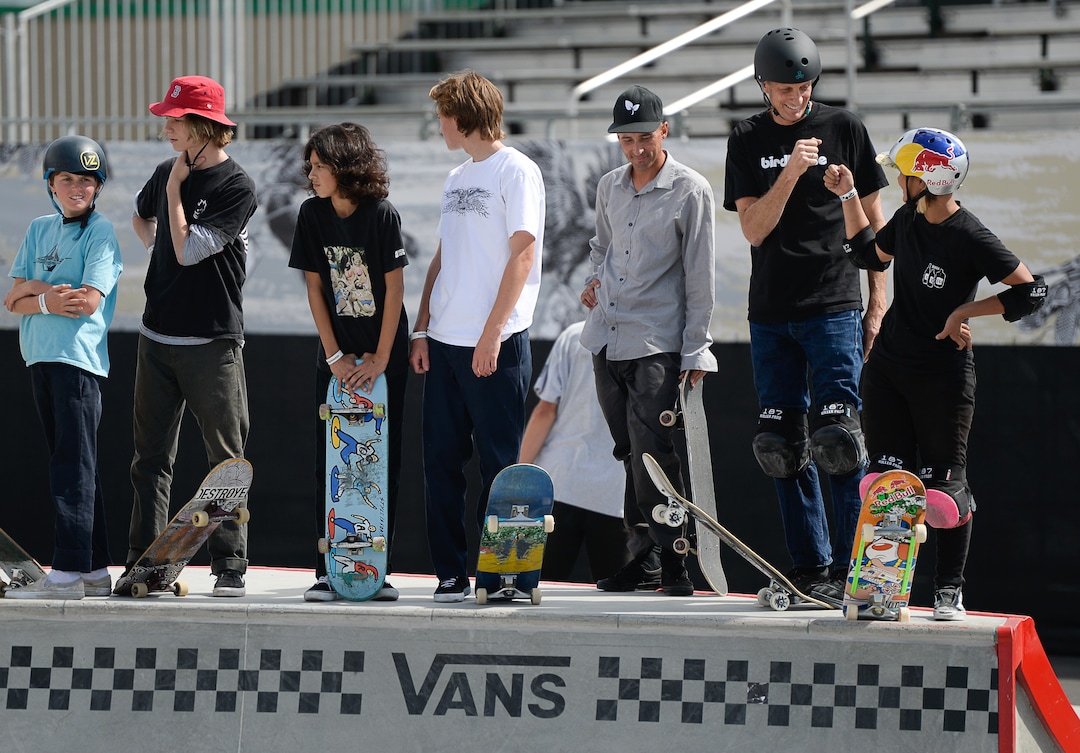 (Francisco Kjolseth  |  The Salt Lake Tribune)  Skate legend Tony Hawk, second from right, bumps fists with pro skater Kisa Nakamura of Japan as they gather with other pro skaters for a community skate and first look of the new Vans - Utah Sports Commission Skatepark at the Utah State Fairpark on Tuesday, Sept. 3, 2019.