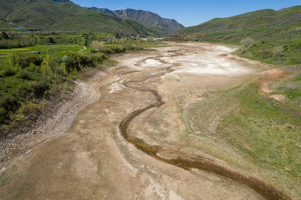 (Trent Nelson | The Salt Lake Tribune) Water trickles through Mountain Dell Reservoir on Wednesday, May 18, 2022.