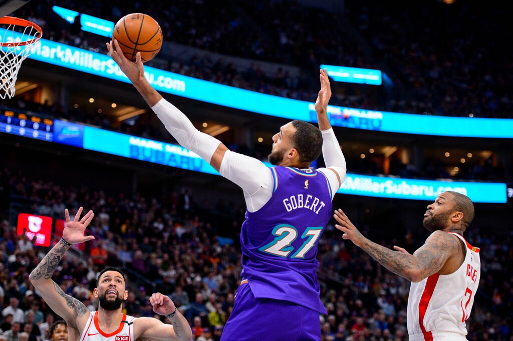 (Trent Nelson  |  The Salt Lake Tribune) Utah Jazz center Rudy Gobert (27) pulls in a rebound as the Utah Jazz host the Houston Rockets, NBA basketball in Salt Lake City on Monday, Jan. 27, 2020.