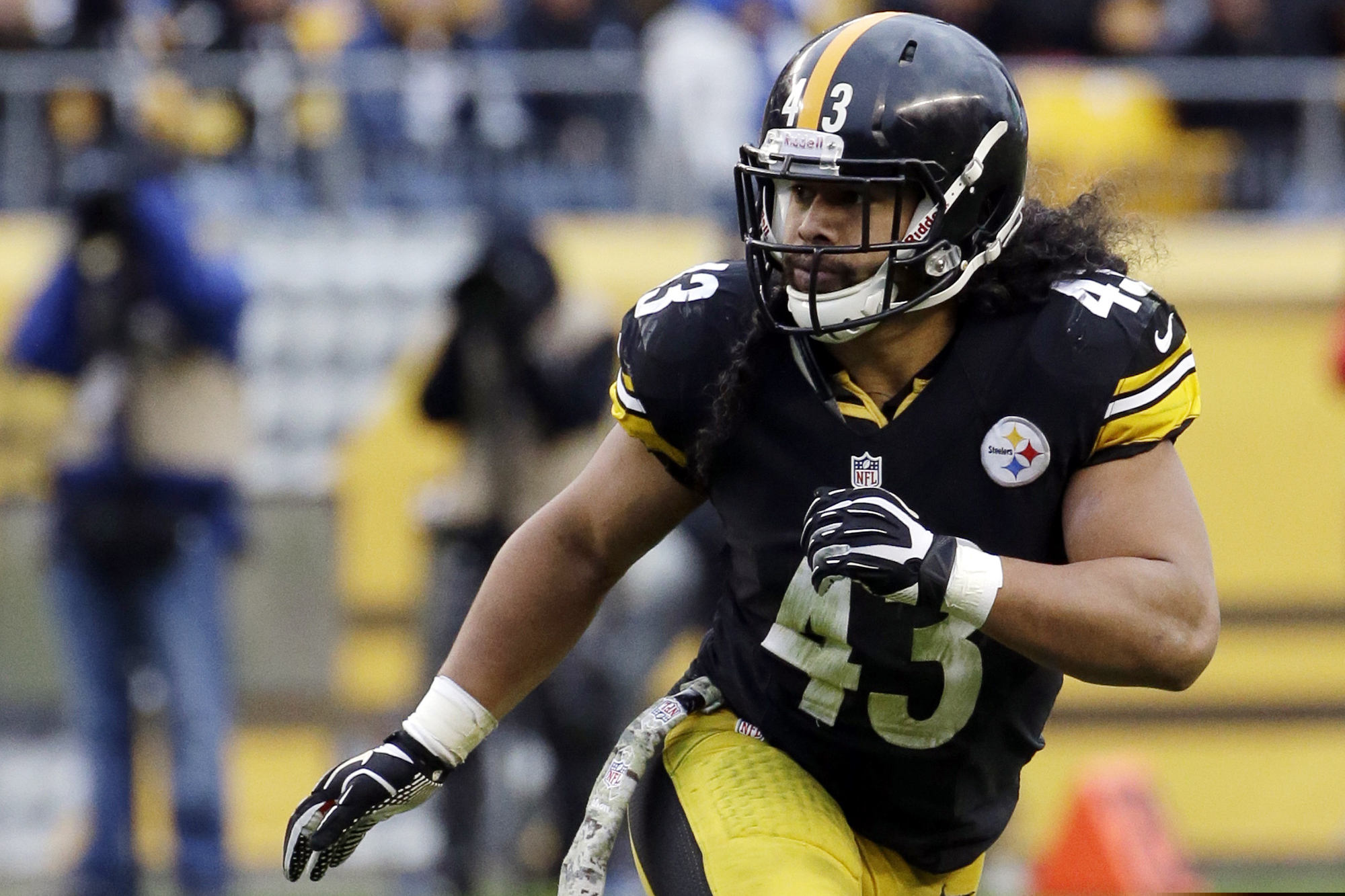 FILE - In this Nov. 10, 2013, file photo, Pittsburgh Steelers' Troy Polamalu follows the action during the second half of an NFL football game against the Buffalo Bills in Pittsburgh. John Lynch, now the general manager of the 49ers who will play the Chiefs in Sunday's Super Bowl, is up for the seventh time. Steve Atwater is a finalist for the third time. LeRoy Butler and first-year eligible Troy Polamalu complete the quartet of safeties among the 15 final candidates for the Pro Football Hall of Fame. (AP Photo/Gene J. Puskar, File)