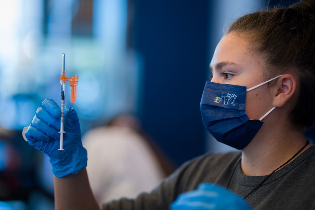 (Trent Nelson  |  The Salt Lake Tribune) Claire Quick administers COVID-19 vaccinations at Vivint Arena in Salt Lake City on Friday, Oct. 29, 2021.