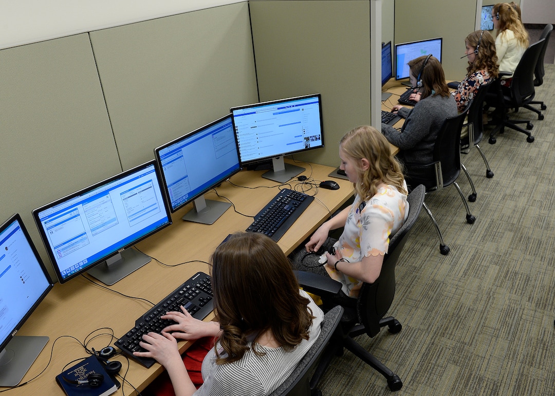 (Scott Sommerdorf | The Salt Lake Tribune) Rows of female missionaries spoke to contacts from the Temple Square North Visitor's Center, Thursday, March 8, 2018.