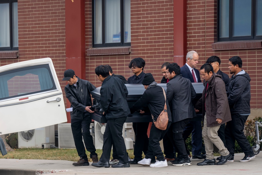 (Rick Egan | The Salt Lake Tribune) Pall bearers bring one of the three caskets out to the hearse, after the funeral services for Bu Meh and three of her children, on Saturday, Dec 21, 2024.