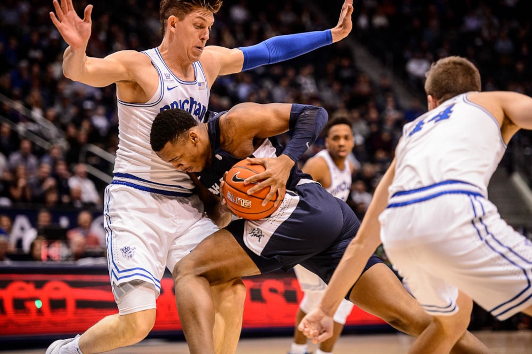 (Trent Nelson | The Salt Lake Tribune)  Utah State Aggies forward Dwayne Brown Jr. (2) is called for the offensive foul on Brigham Young Cougars forward Dalton Nixon (33) as BYU hosts Utah State, NCAA basketball in Provo on Wednesday Dec. 5, 2018.