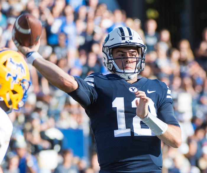 (Rick Egan  |  The Salt Lake Tribune)    Brigham Young Cougars quarterback Tanner Mangum (12) throws a touchdown pass in football action Brigham Young Cougars vs McNeese State Cowboys at Lavell Edwards Stadium, Saturday, Sept. 22, 2018.


