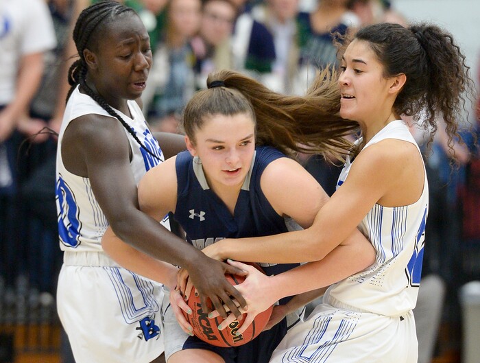 (Leah Hogsten  |  The Salt Lake Tribune)  Bingham's Shanyce Makuei (20) and Bingham's Ameleya Angilau (12) pressure Copper Hills' Breaunna Gillen (23). Bingham faces Copper Hills in their semifinal game of the 6A High School Girls' Basketball Tournament at SLCC in Taylorsville, Friday, Feb. 23, 2018. 