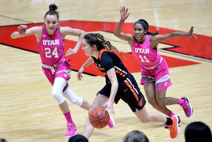 Scott Sommerdorf | The Salt Lake TribuneUtah Utes guard/forward Tilar Clark (24) and Utah Utes guard Erika Bean (11) chase Oregon State Beavers guard Aleah Goodman (1) during first half play. Utah led Oregon State 36-34 at the half, but lost the game 69-58, Friday, January 26, 2018.