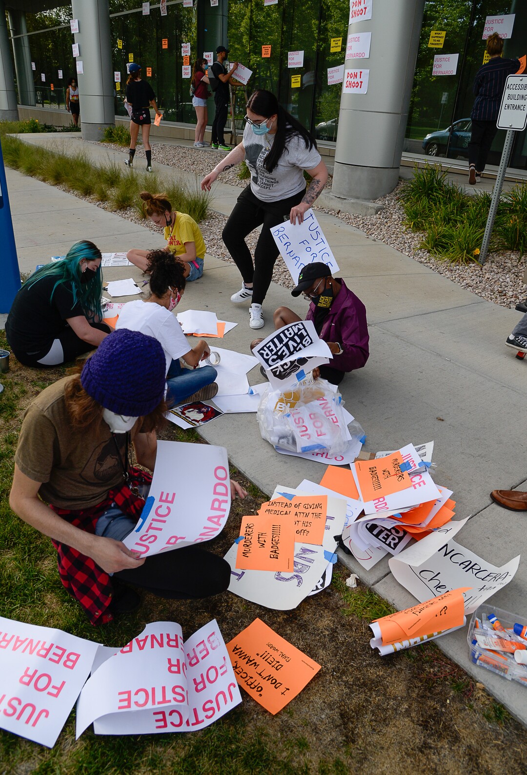 (Francisco Kjolseth  |  The Salt Lake Tribune) A group of about twenty people again showed up at the Salt Lake County District AttorneyÕs Office on Sunday, June 21, 2020, as part of their vow to come out every day until officials release the investigation into Bernardo Palacios-CarbajalÕs death by police. They hung protest signs on the building's windows.