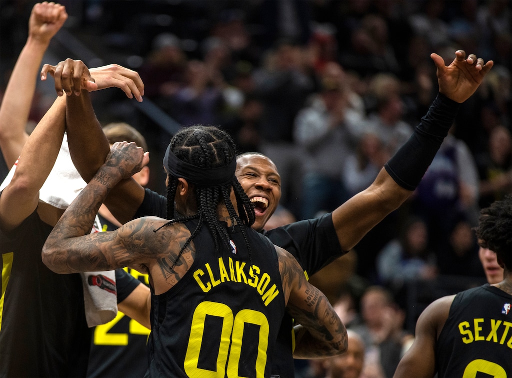 (Rick Egan | The Salt Lake Tribune)  The Utah Jazz bench reacts after Jordan Clarkson (00) grabbed a rebound for a triple-double, in NBA action between the Utah Jazz and the Dallas Mavericks, at the Delta Center, on Monday, January 1, 2024.