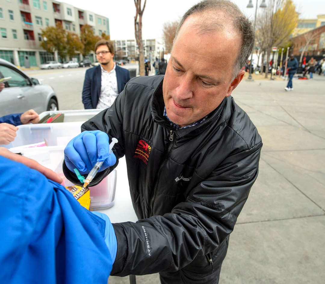 (Steve Griffin  |  The Salt Lake Tribune) Steven Beach, a registered nurse with the Salt Lake County Health Department, administers a Hepatitis A vaccination at a mobile vaccination clinic setup outside at 500 west and 200 south in Salt Lake City Thursday November 16, 2017. The department is setting up the clinics to address the county's outbreak of Hepatitis A . There have been 66 cases here so far this year, mostly in homeless community.