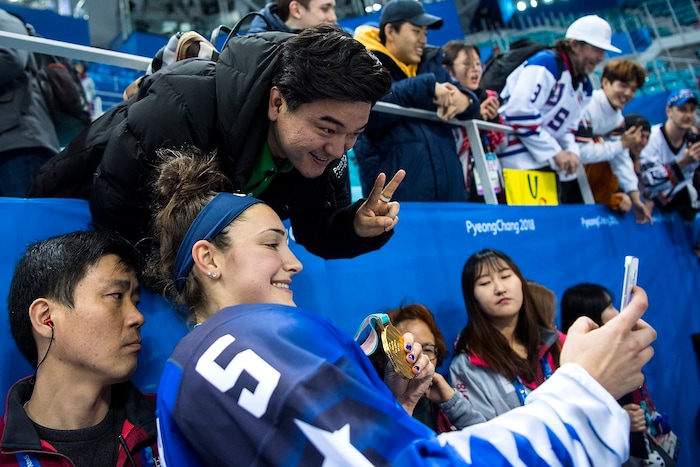 (Chris Detrick  |  The Salt Lake Tribune) United States defenseman Megan Keller (5) takes a selfie with a fan after winning the Women's Gold Medal Game at Gangneung Hockey Centre during the Pyeongchang 2018 Winter Olympics Thursday, Feb. 22, 2018. United States defeated Canada 3-2 in a shootout victory. 