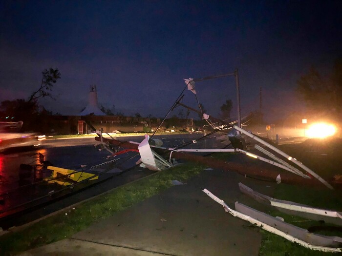 (David A. Lieb | AP) Downed power lines stretch into a street in tornado-hit Jefferson City, MO., Thursday, May 23, 2019. The National Weather Service has confirmed a large and destructive tornado has touched down in Missouri's state capital, causing heavy damage and trapping multiple people in the wreckage of their homes.