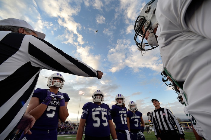 (Scott Sommerdorf   |  The Salt Lake Tribune)   Lehi and Olympus players watch the coin toss in Lehi. Lehi led Olympus 26-0 late in the second half, Friday, September 22, 2017.